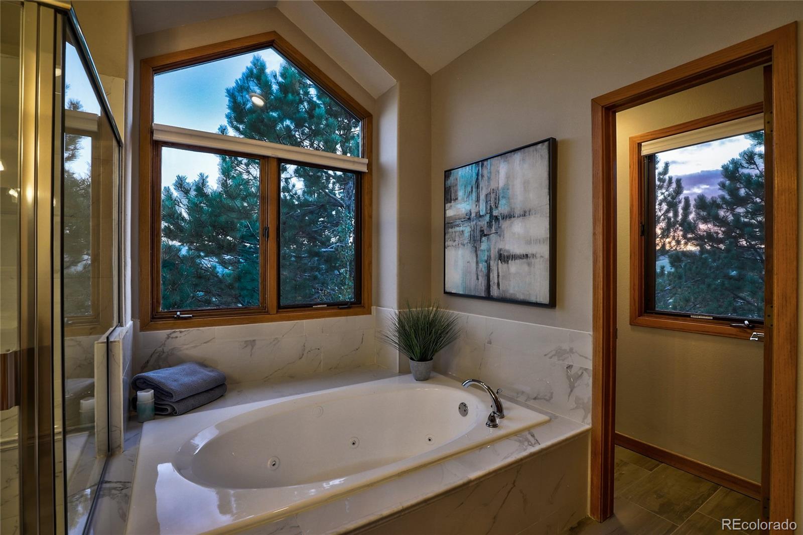 386 Monte Vista Road Golden, CO 80401 - Photo 20 of 32 a bathroom with a tub and a window