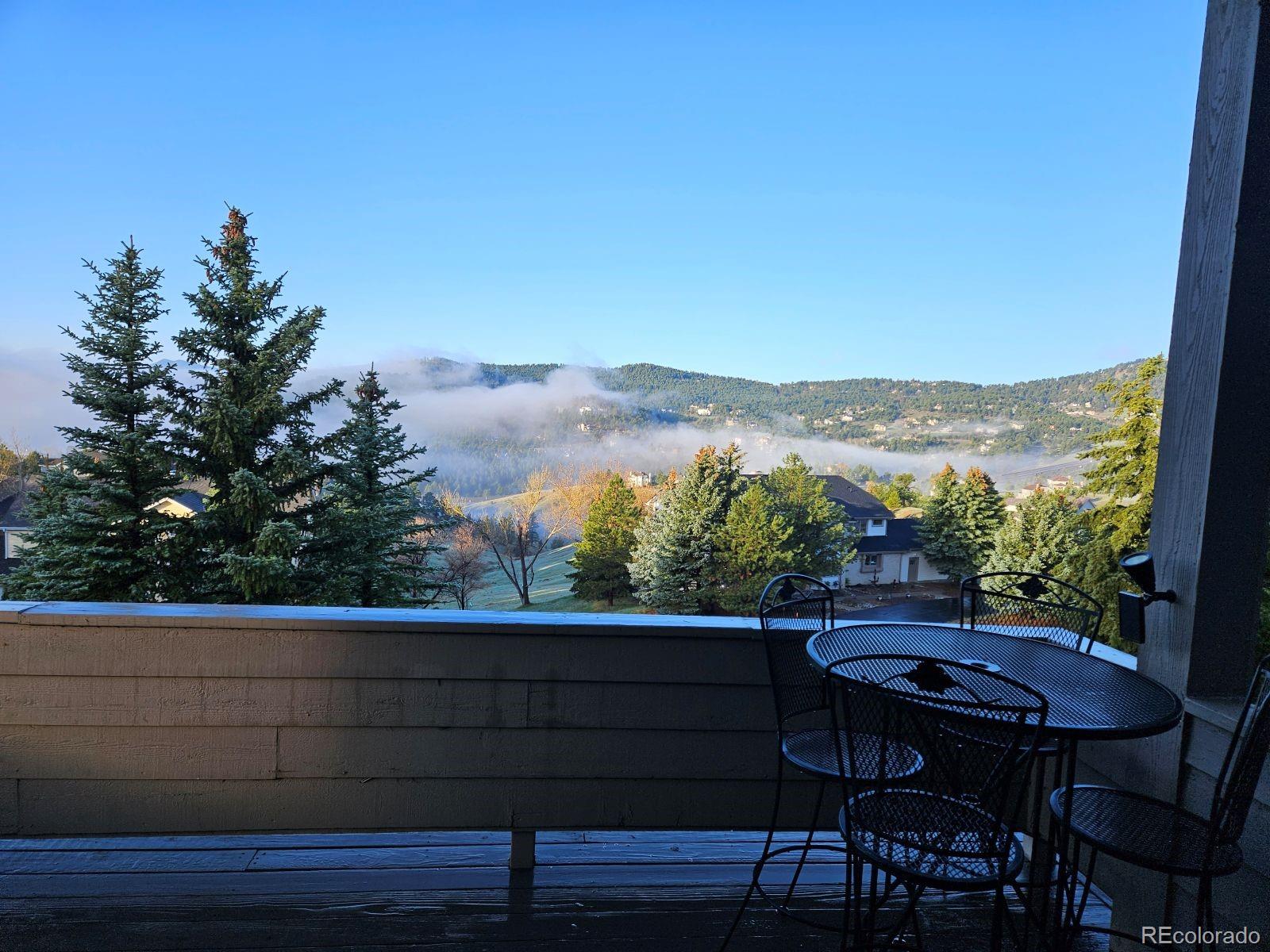 386 Monte Vista Road Golden, CO 80401 - Photo 2 of 32 a view of a chairs and table on the terrace