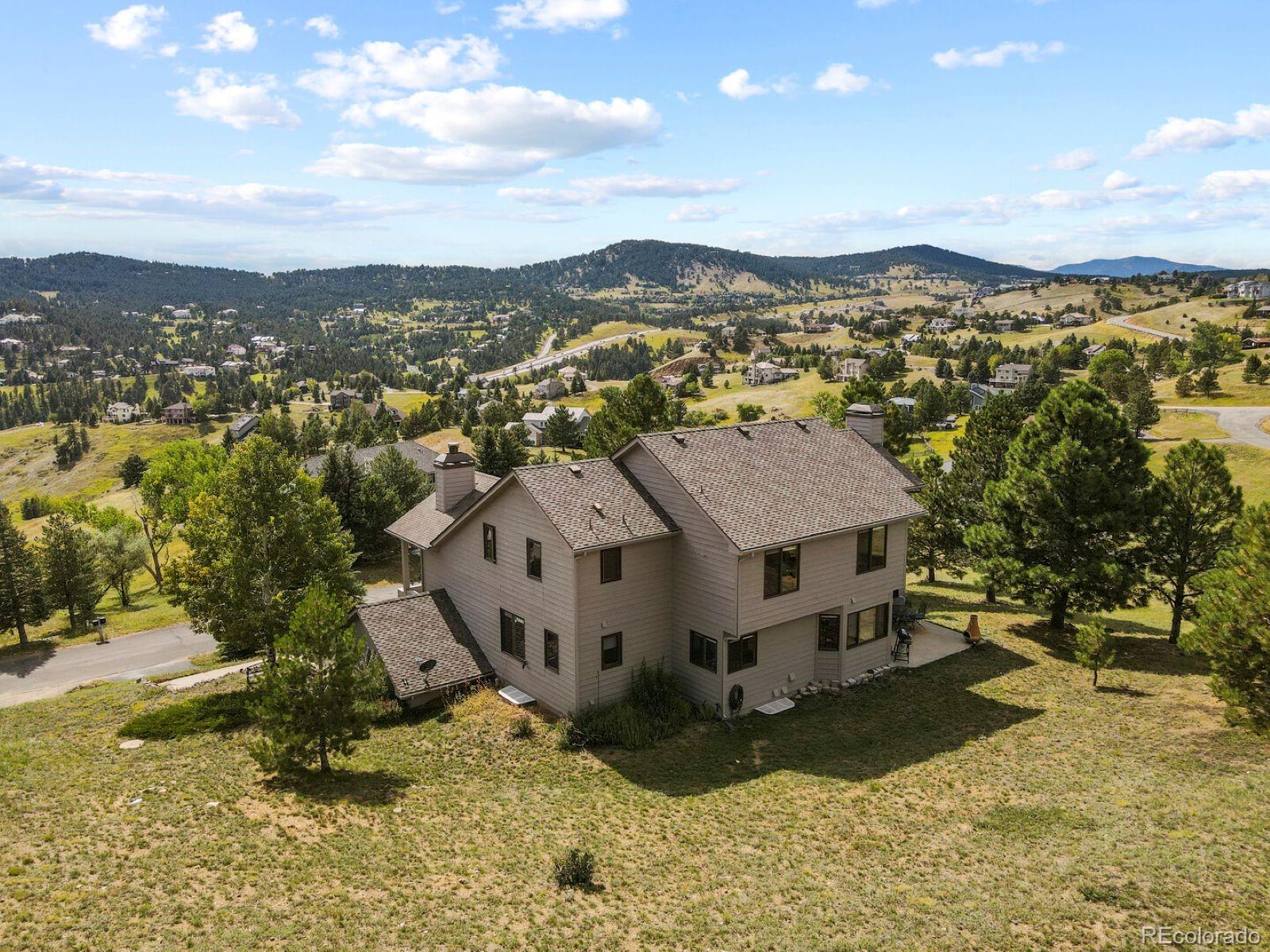 386 Monte Vista Road Golden, CO 80401 - Photo 31 of 32 a view of a house with a yard
