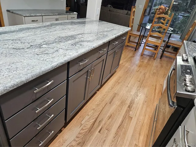 a kitchen with sink and cabinets