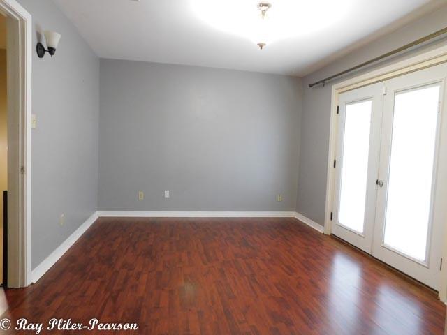 8020 Pines Road Shreveport, LA 71129 - Photo 10 of 24 One of two upstairs primary bedrooms each with ensuite bathrooms. This bedroom faces the back of property and has a private deck overlooking the golf course.