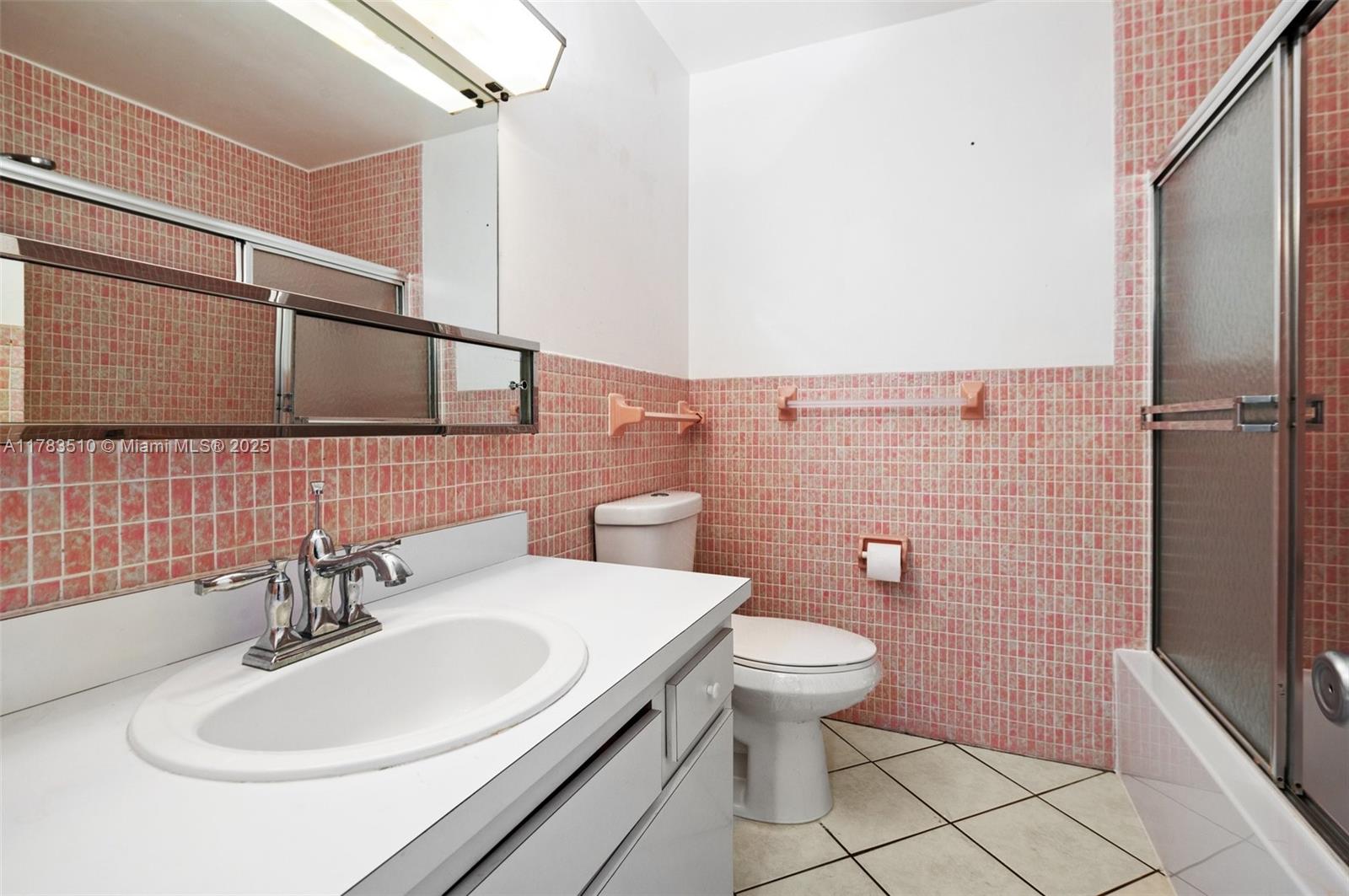 5300 Washington Street, Unit G323 Hollywood, FL 33021 - Photo 23 of 34 a bathroom with a sink a toilet and shower
