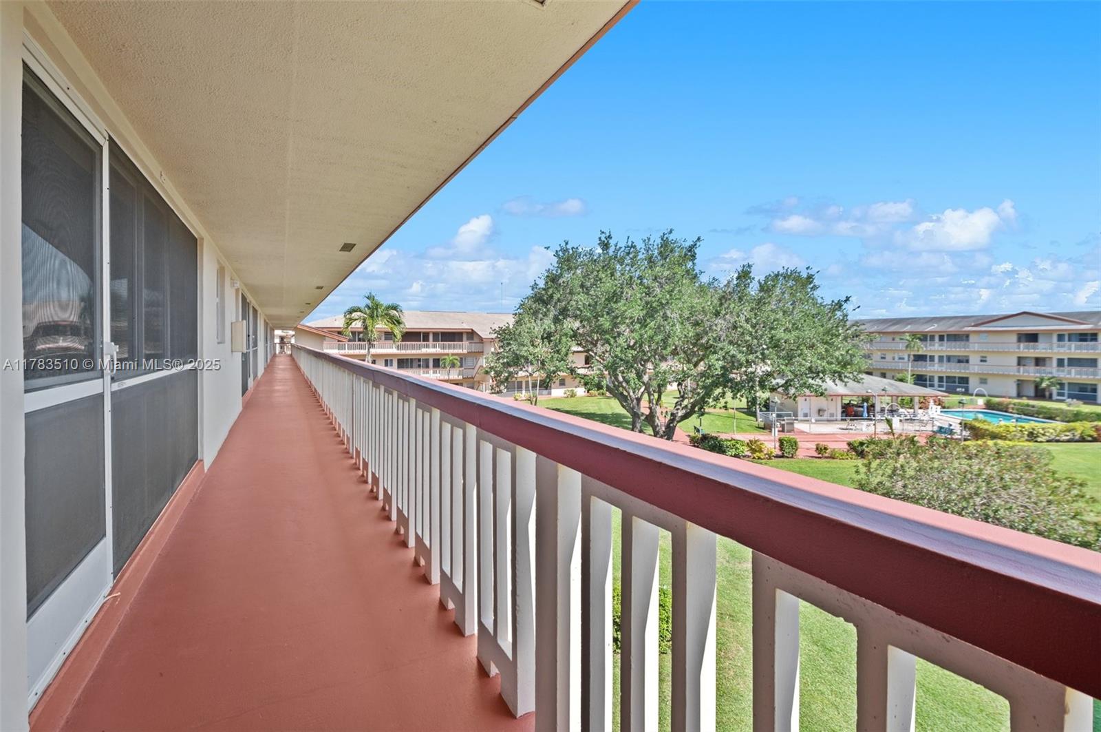 5300 Washington Street, Unit G323 Hollywood, FL 33021 - Photo 5 of 34 a view of balcony with wooden floor and fence