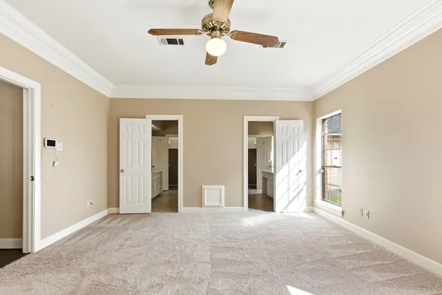 a spacious bathroom with a shower and a sink