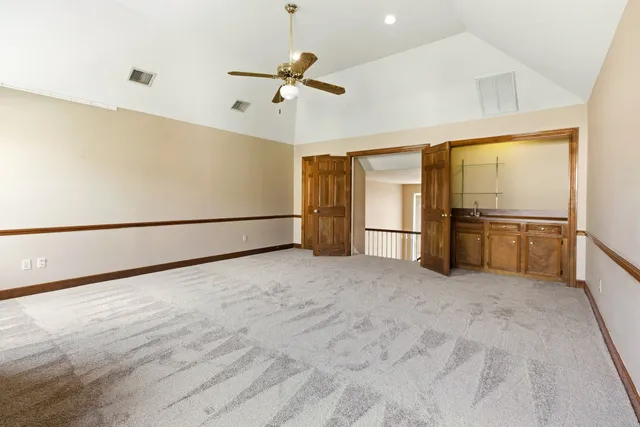 a bathroom with a shower sink and mirror