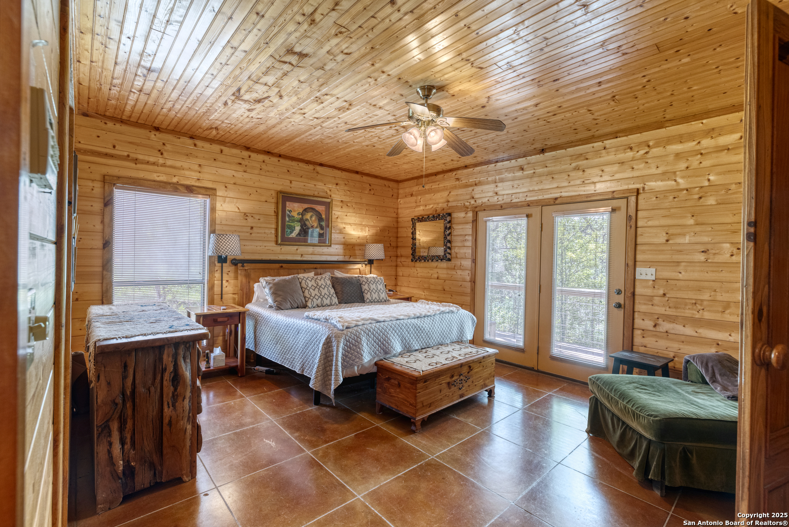4983 Ranch Road 1051 Uvalde, TX 78801 - Photo 22 of 72 a spacious bedroom with a bed and wooden floor