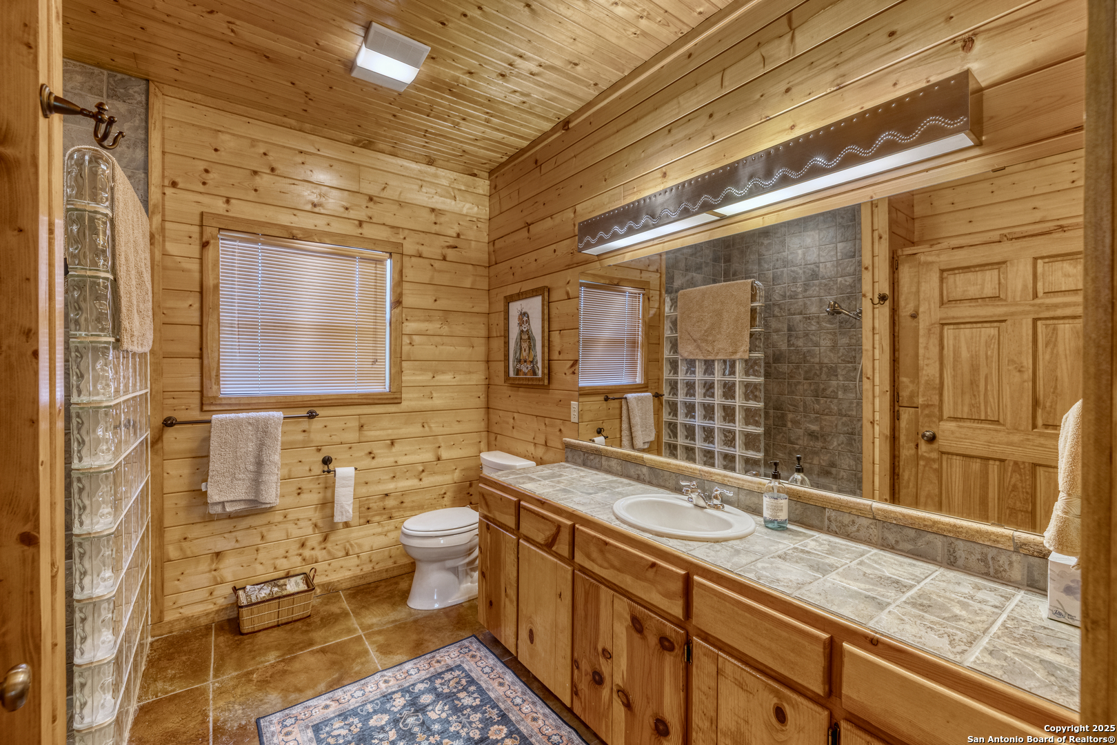 4983 Ranch Road 1051 Uvalde, TX 78801 - Photo 31 of 72 a bathroom with a granite countertop sink mirror and double