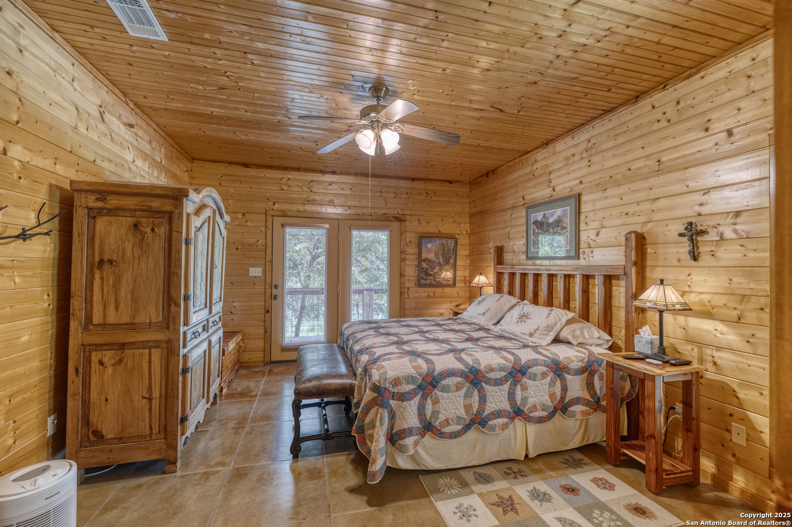 4983 Ranch Road 1051 Uvalde, TX 78801 - Photo 32 of 72 a bedroom with a bed and wooden floor