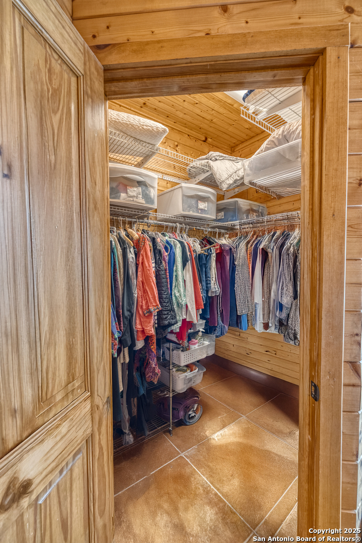 4983 Ranch Road 1051 Uvalde, TX 78801 - Photo 33 of 72 a view of walk in closet with clothes