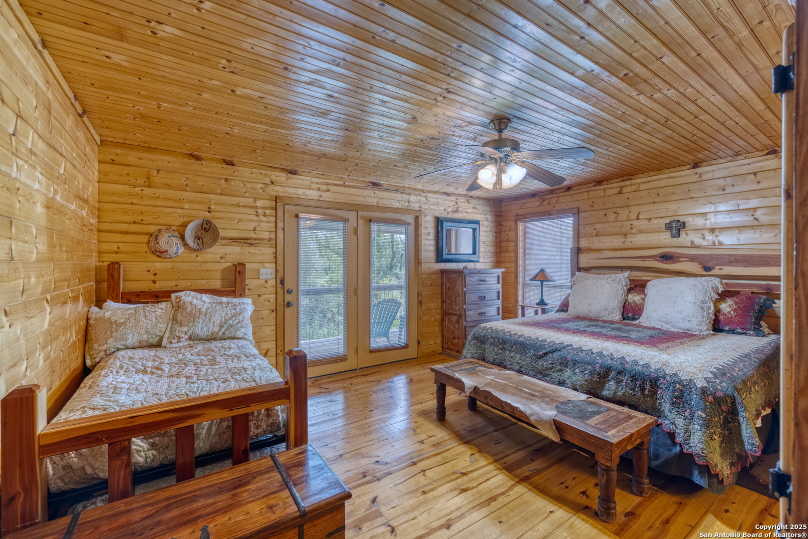4983 Ranch Road 1051 Uvalde, TX 78801 - Photo 37 of 72 a bedroom with a bed and wooden floor