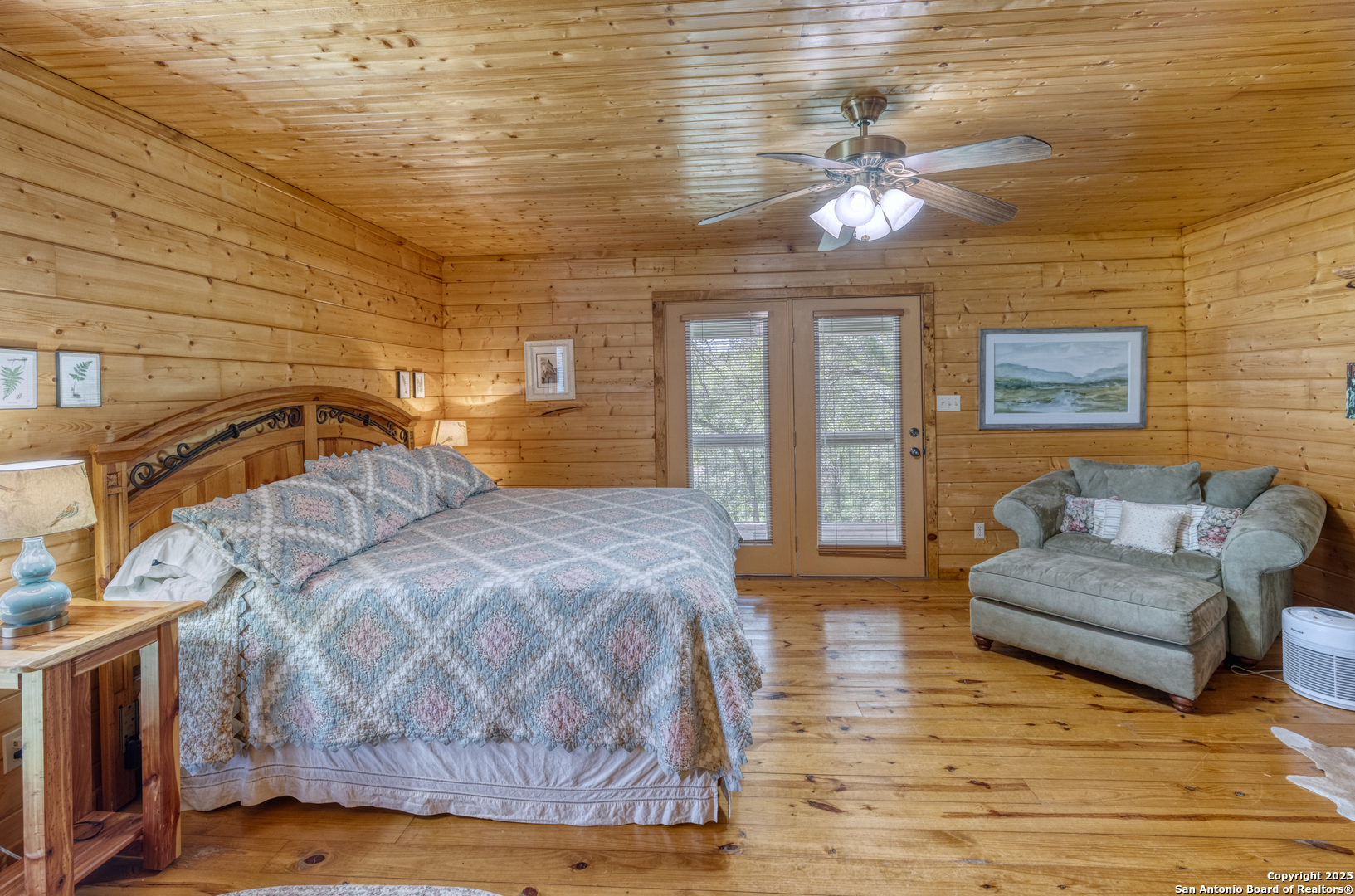 4983 Ranch Road 1051 Uvalde, TX 78801 - Photo 42 of 72 a bedroom with a large bed and a chandelier