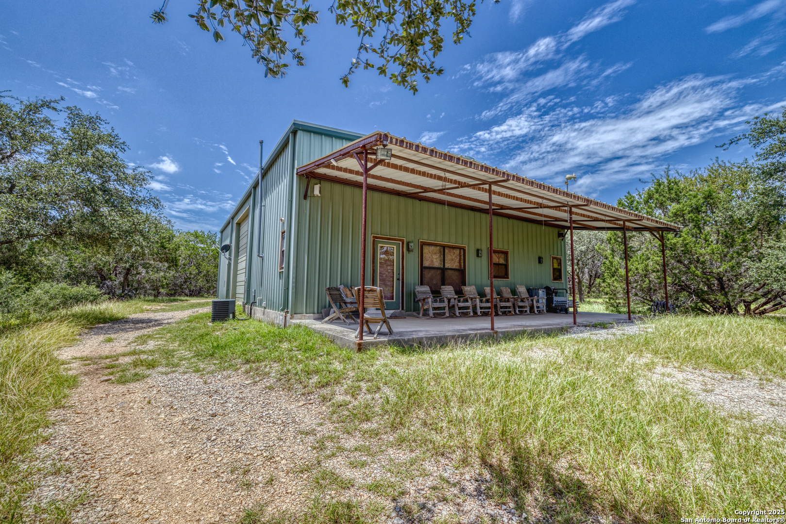 4983 Ranch Road 1051 Uvalde, TX 78801 - Photo 43 of 72 a view of house with backyard and patio