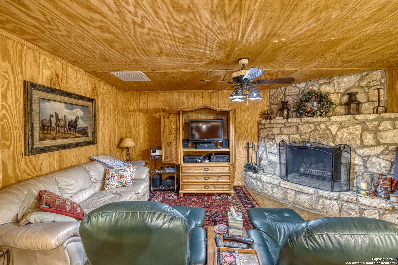 4983 Ranch Road 1051 Uvalde, TX 78801 - Photo 45 of 72 a bedroom with furniture and a fireplace