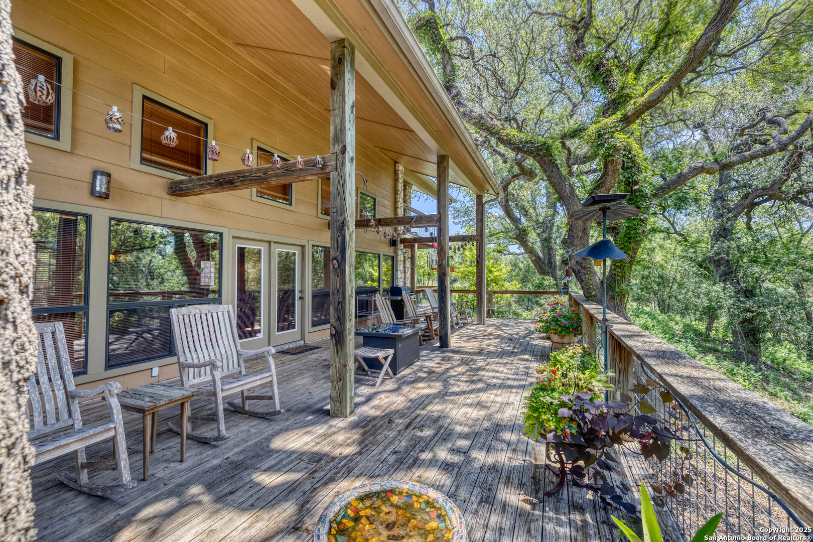4983 Ranch Road 1051 Uvalde, TX 78801 - Photo 60 of 72 a view of a patio with table and chairs and potted plants