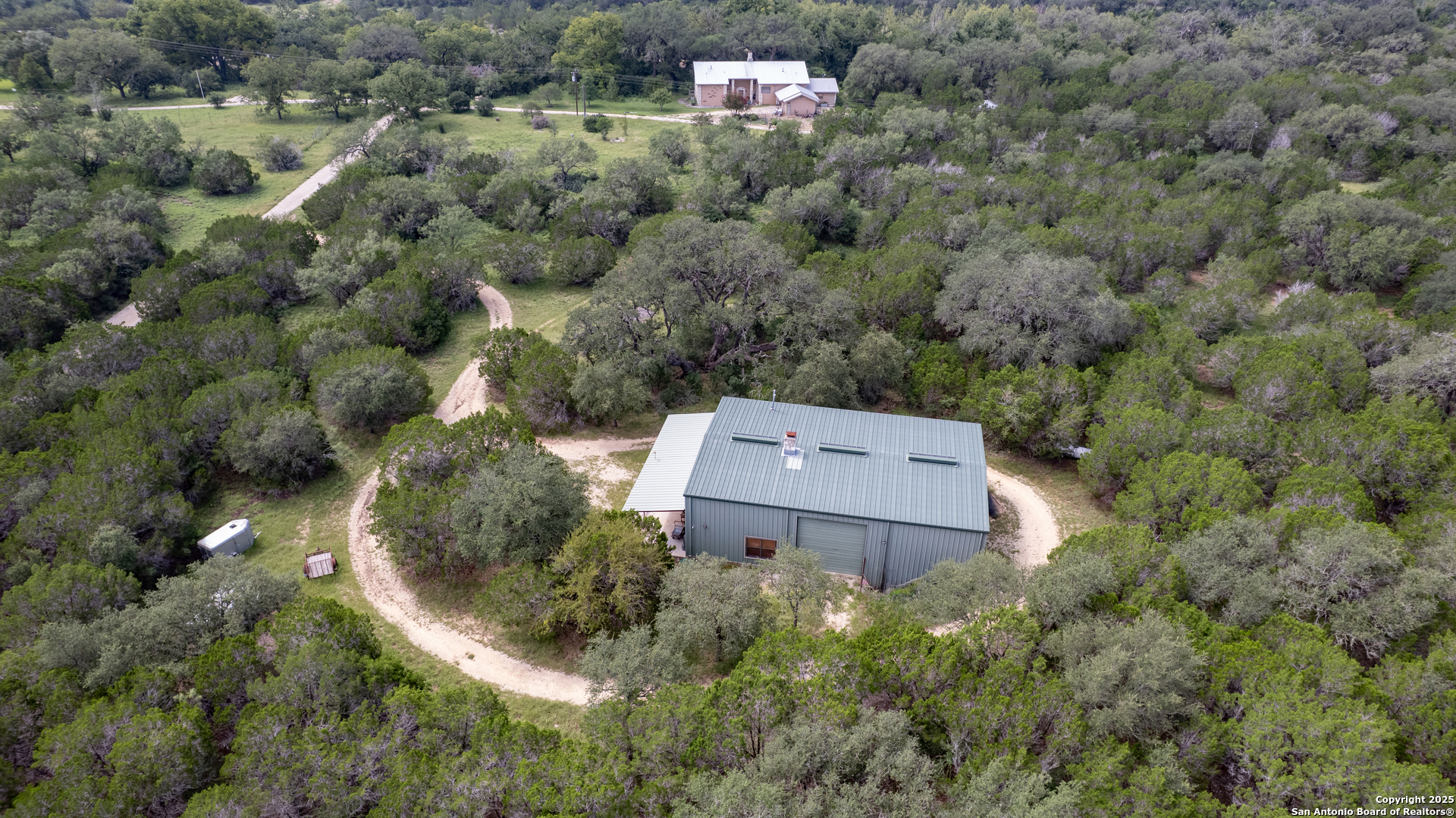 4983 Ranch Road 1051 Uvalde, TX 78801 - Photo 67 of 72 an aerial view of a house with a yard