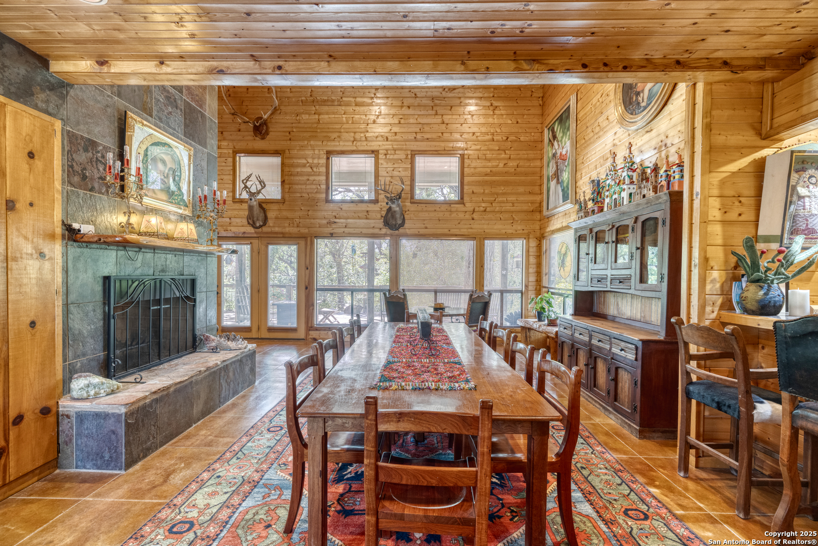 4983 Ranch Road 1051 Uvalde, TX 78801 - Photo 10 of 72 a view of a dining room with furniture window and wooden floor