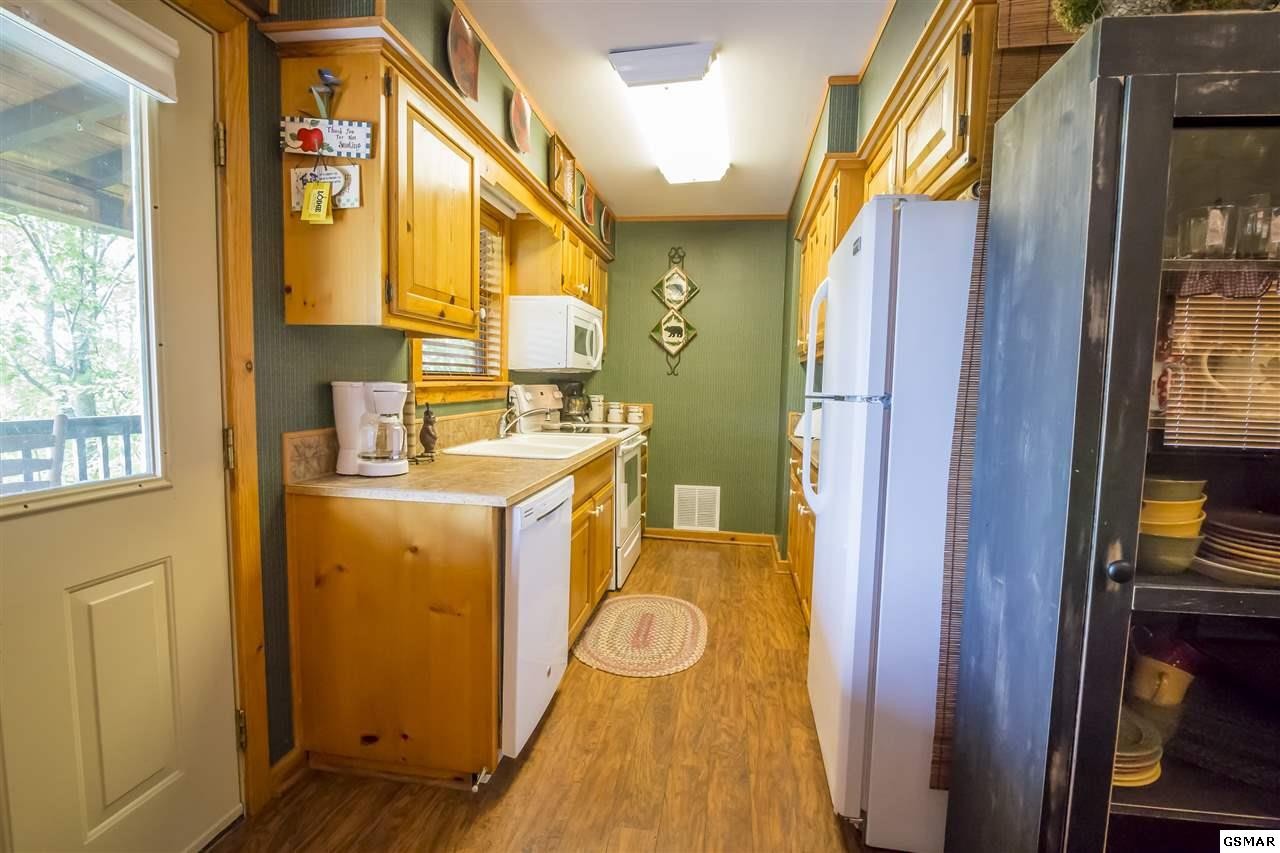 3510 Jakes Ridge Sevierville, TN 37862 - Photo 14 of 29 a utility room with a sink and a mirror