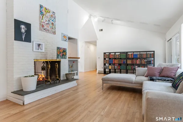 a living room with furniture and a fireplace