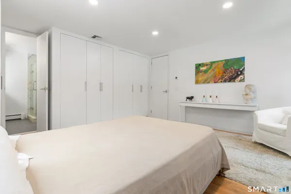 a large white bed in a white room