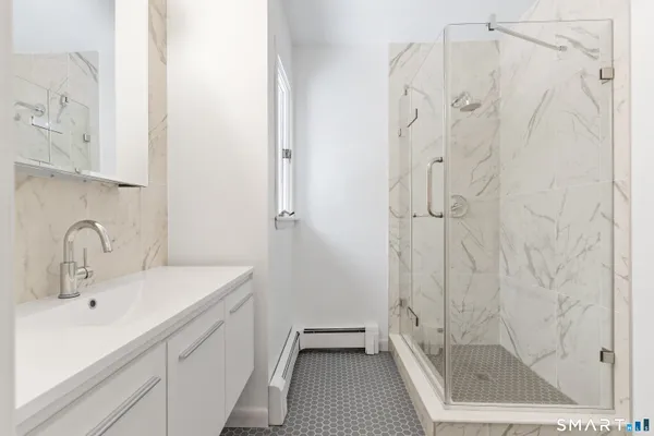 a bathroom with a sink and a shower