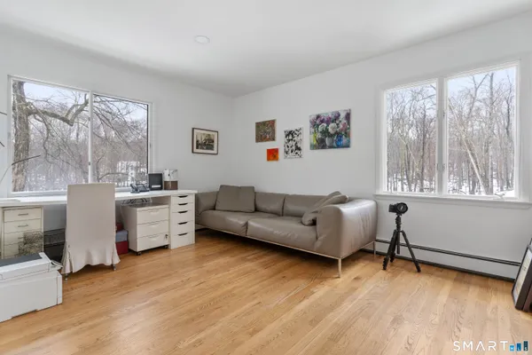 a living room with furniture and windows