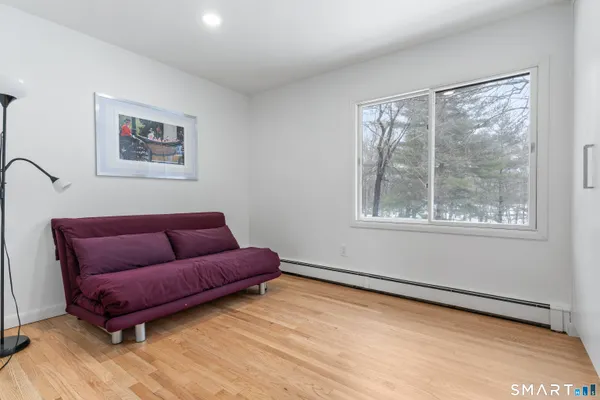 a living room with a couch and a window