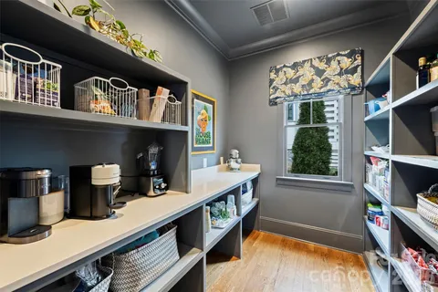 a view of a livingroom with furniture and a window