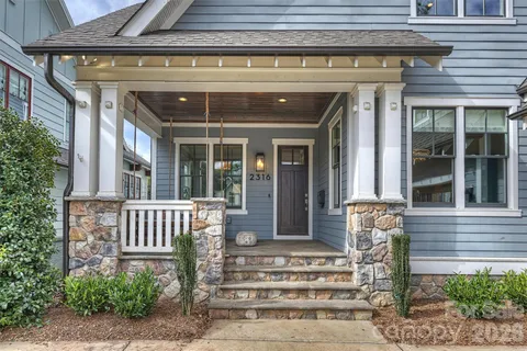 a front view of a house with a porch