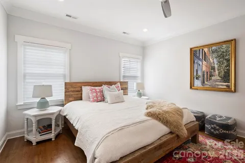 a bedroom with a bed and a chair