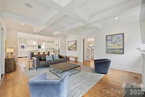 a living room with furniture or couch and a wooden floor