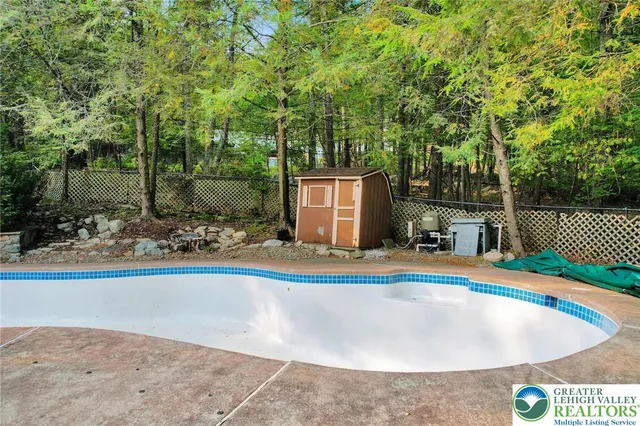 a view of a swimming pool with an outdoor space