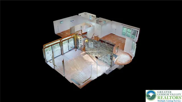 a kitchen with stainless steel appliances granite countertop wooden cabinets and a wooden floor