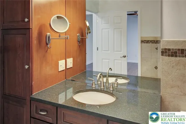 a view of water heater room with wooden floor