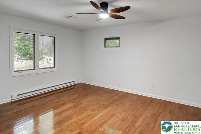 a room with a bed and a mirror