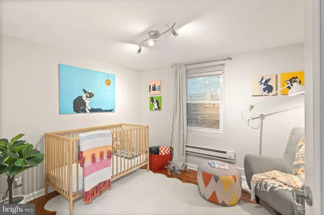 a bedroom with a bed and a chair