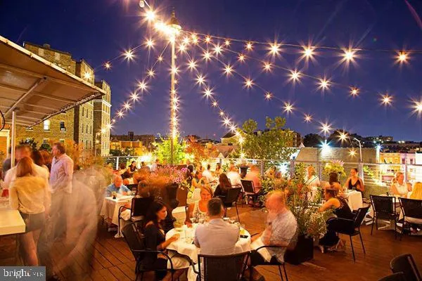 a view of a chairs and table in a backyard