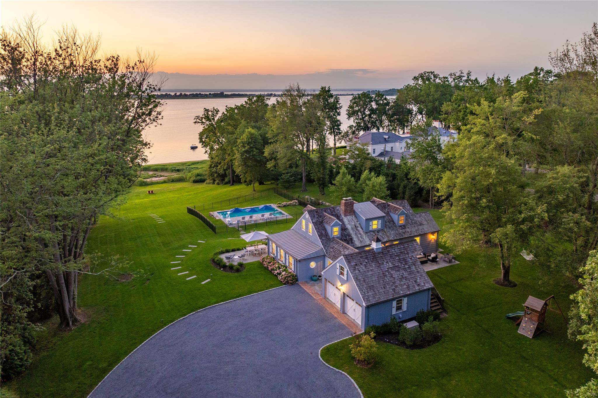 an aerial view of a house with garden space and street view