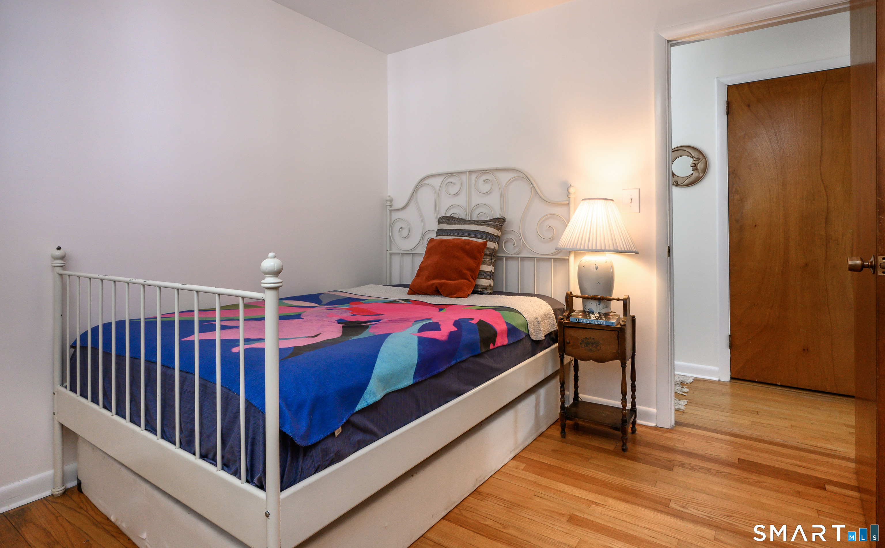 76 South Kent Road Kent, CT 06757 - Photo 12 of 20 a bedroom with a bed and wooden floor