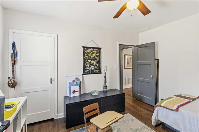 a reading room with furniture and wooden floor