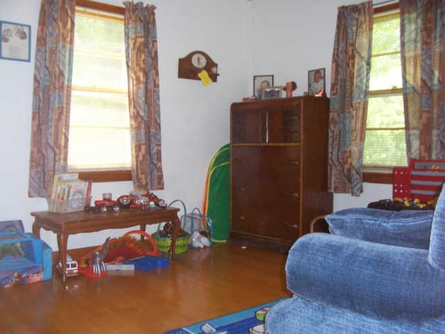 203 Jackson Heights Road Columbia, TN 38401 - Photo 13 of 15 Third bedroom has hardwood floors and currently used as a playroom.