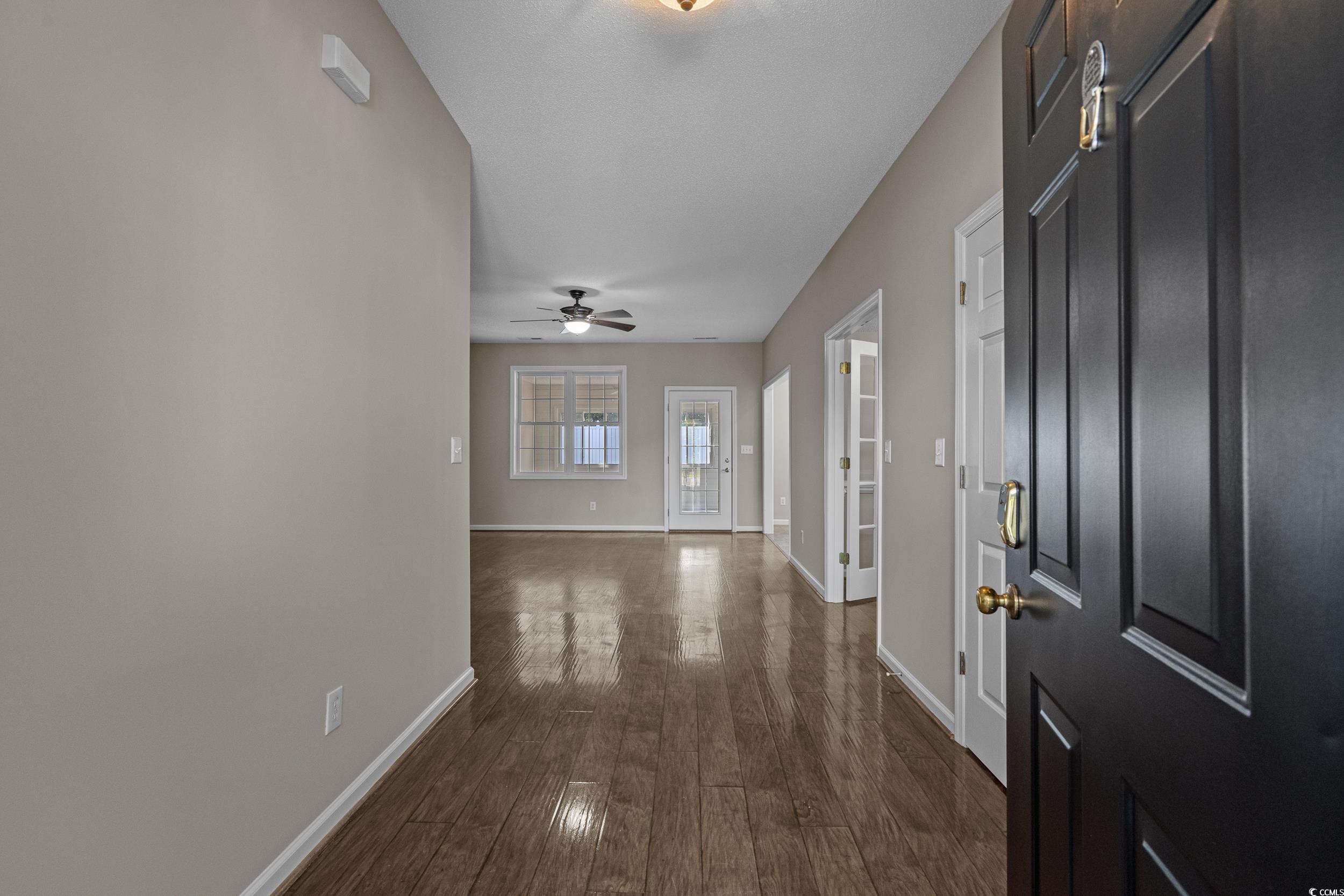 4191 Friendfield Trace Little River, SC 29566 - Photo 3 of 40 Foyer featuring dark wood-style floors and ceiling fan
