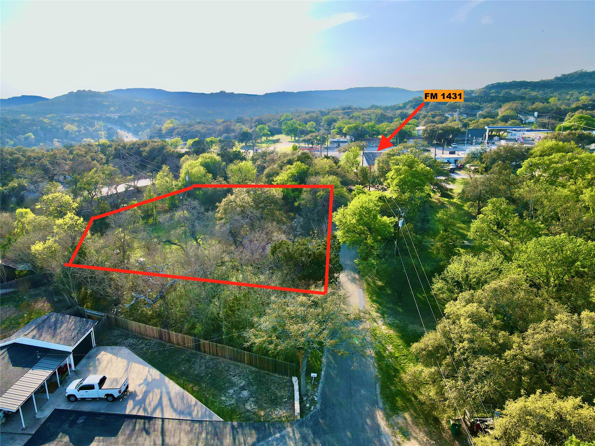 18311 Spring Lane Jonestown, TX 78645 - Photo 3 of 11 a view of a lot of trees and houses