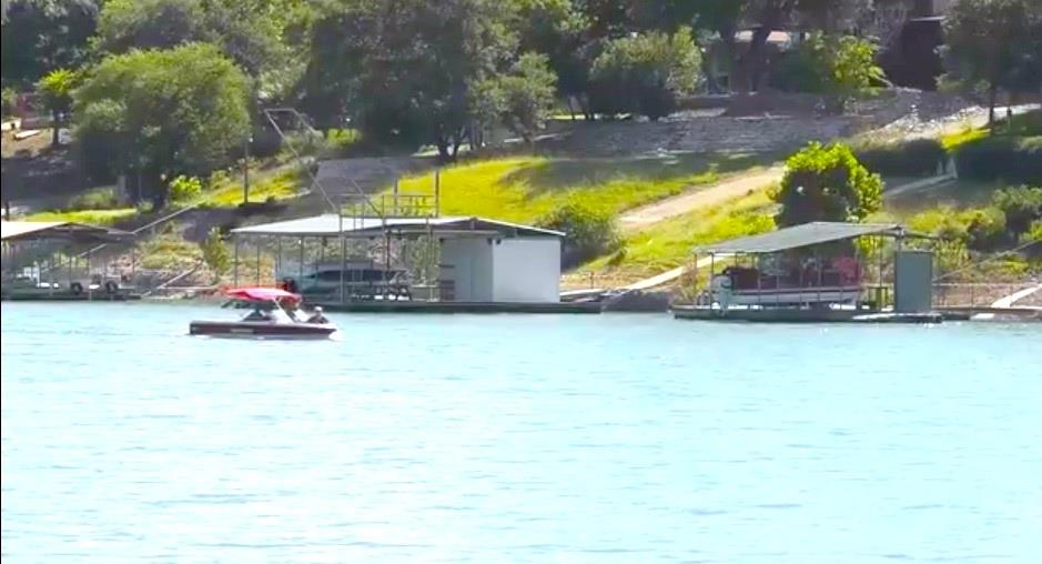 18311 Spring Lane Jonestown, TX 78645 - Photo 6 of 11 a swimming pool with outdoor seating