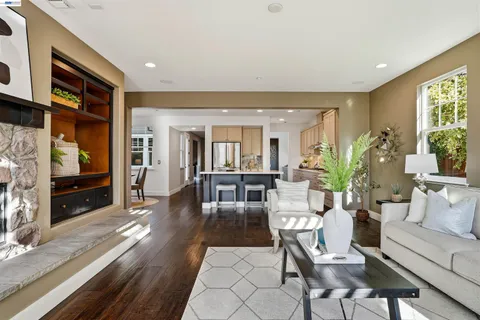 a view of a patio with a table and chairs and potted plants