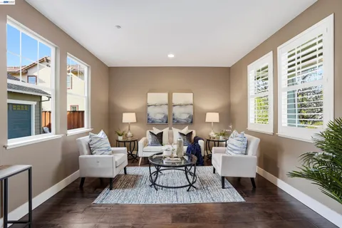 a kitchen with stainless steel appliances white cabinets and a window