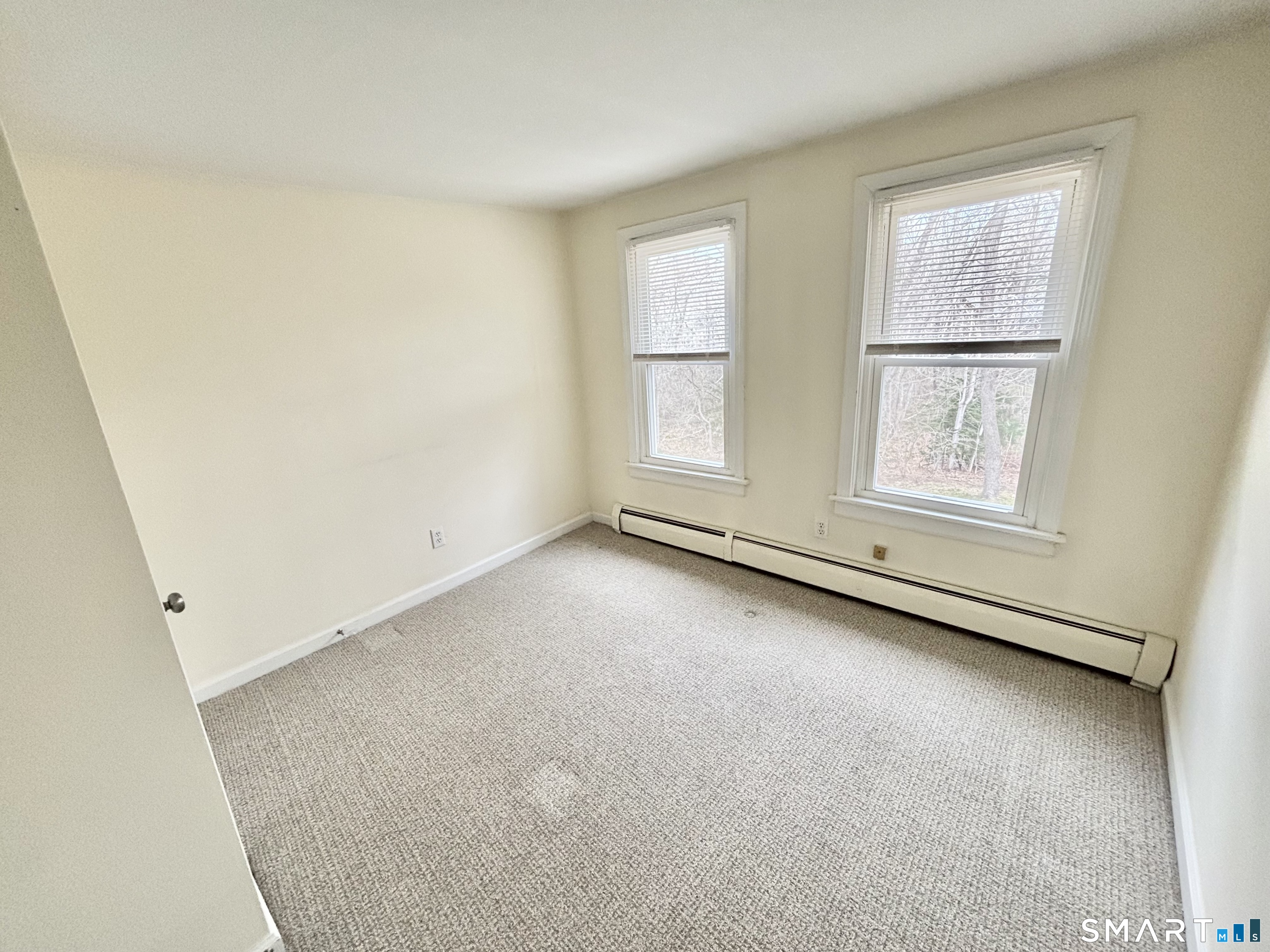 61 Scotland Avenue, Unit NORTH Madison, CT 06443 - Photo 13 of 19 an empty room with windows