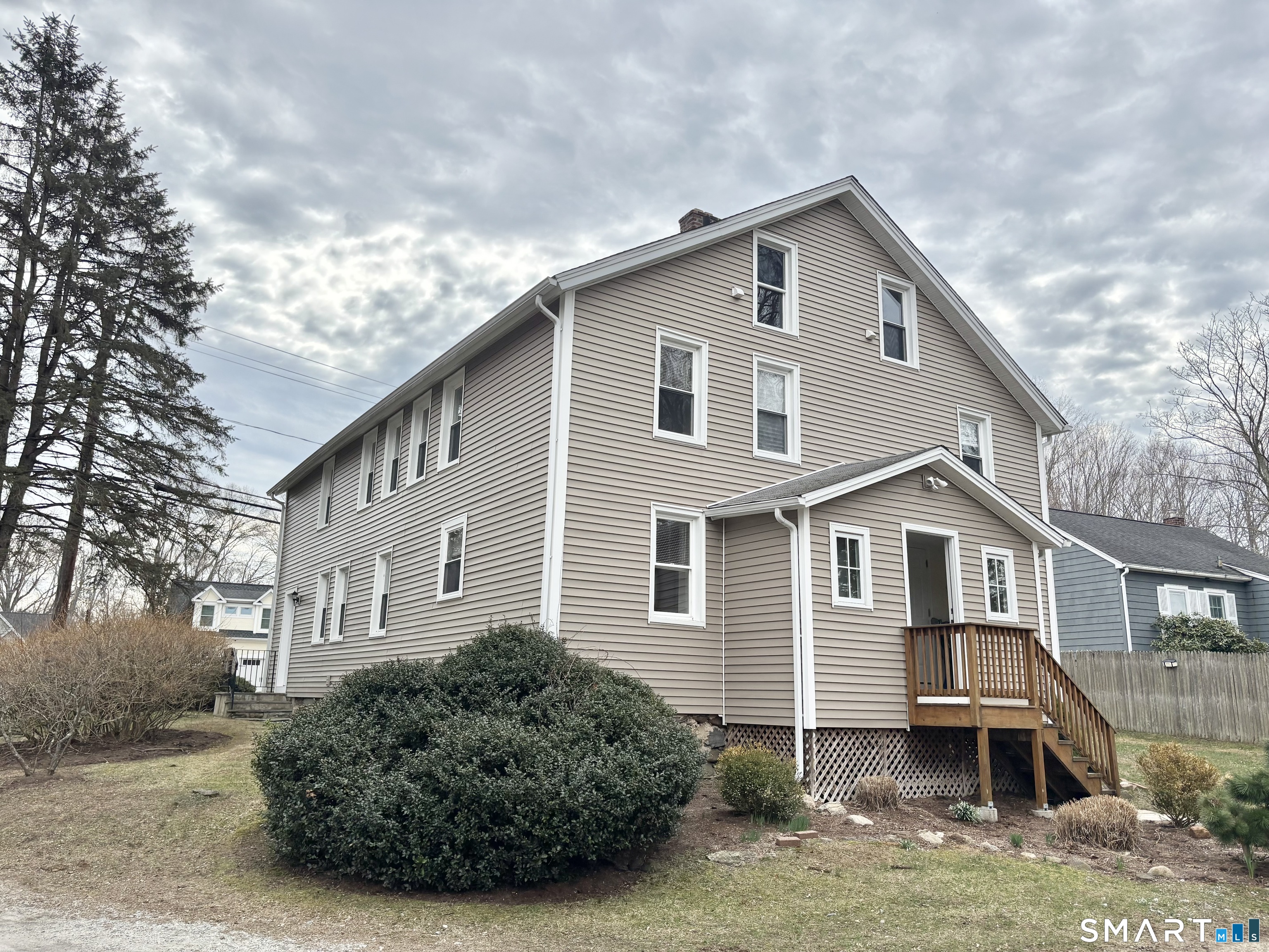 61 Scotland Avenue, Unit NORTH Madison, CT 06443 - Photo 2 of 19 a front view of a house with garage