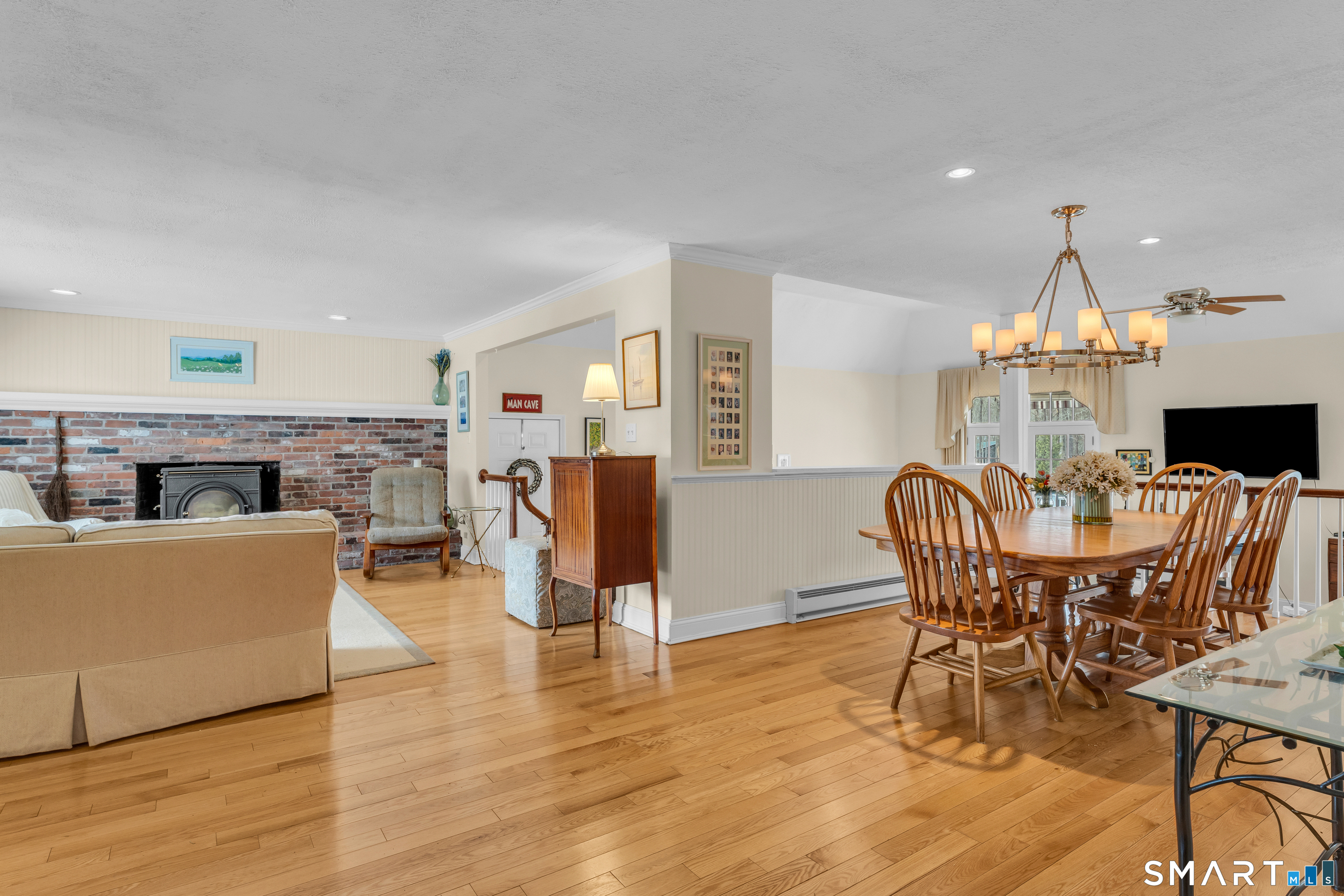 110 Nut Plains Road Guilford, CT 06437 - Photo 12 of 40 One beautiful space flows into the next. The living room opens to the dining area and overlooks the family room beyond, an entertainer's dream layout.
