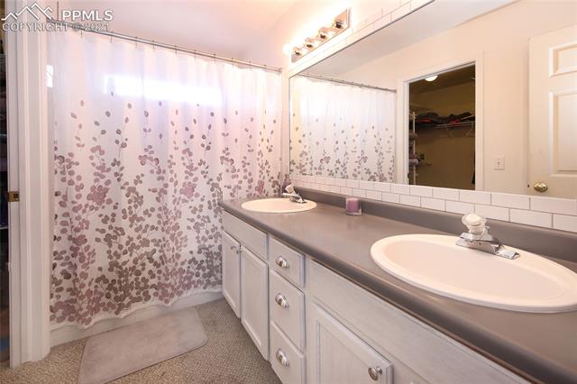 8107 Oliver Road Peyton, CO 80831 - Photo 18 of 36 Master bathroom with walk in closet