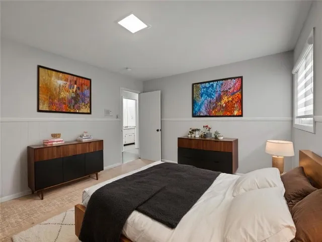 a bedroom with a bed and a couch